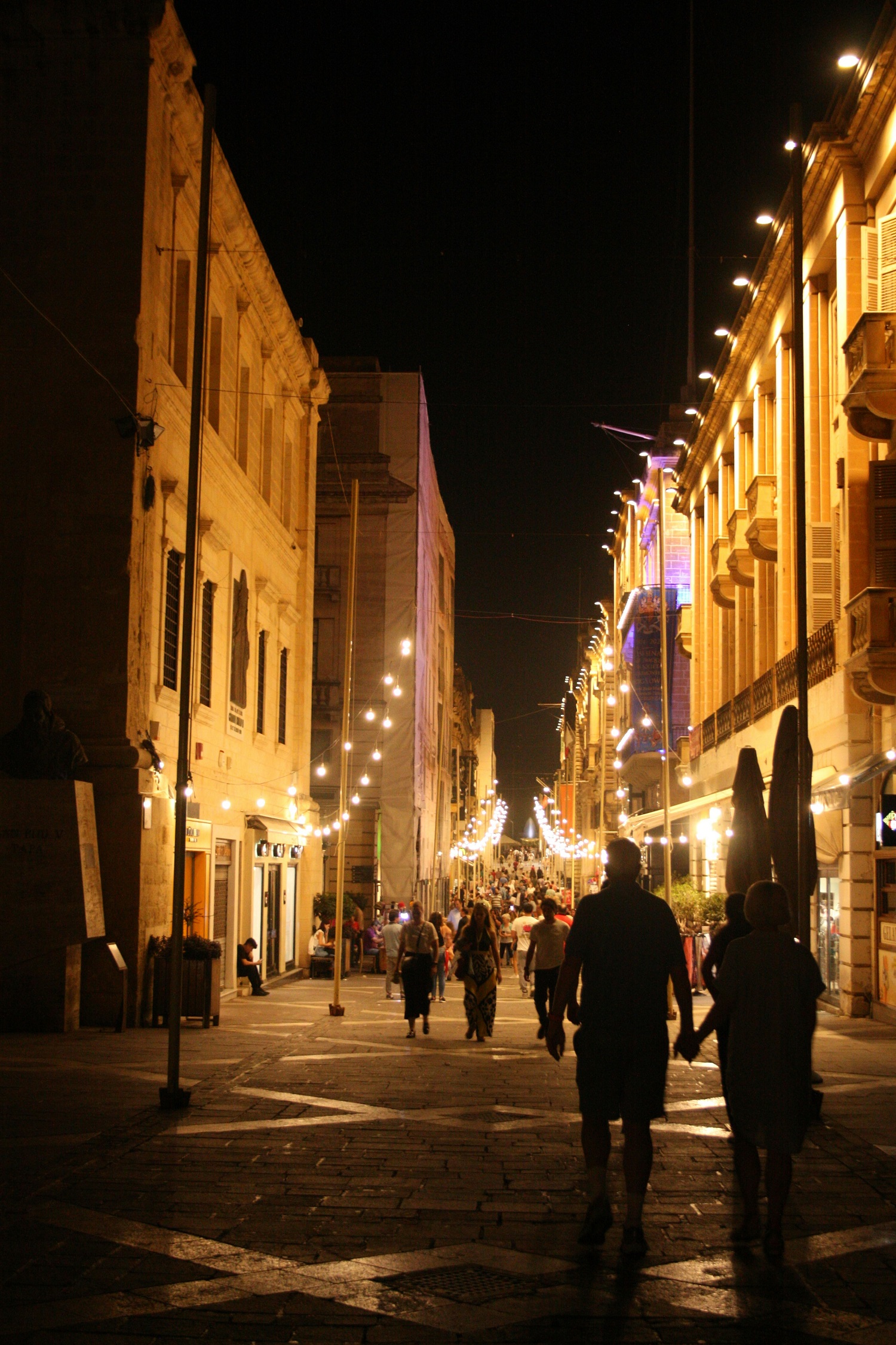 Valletta streets lit up at night during a festival, Malta