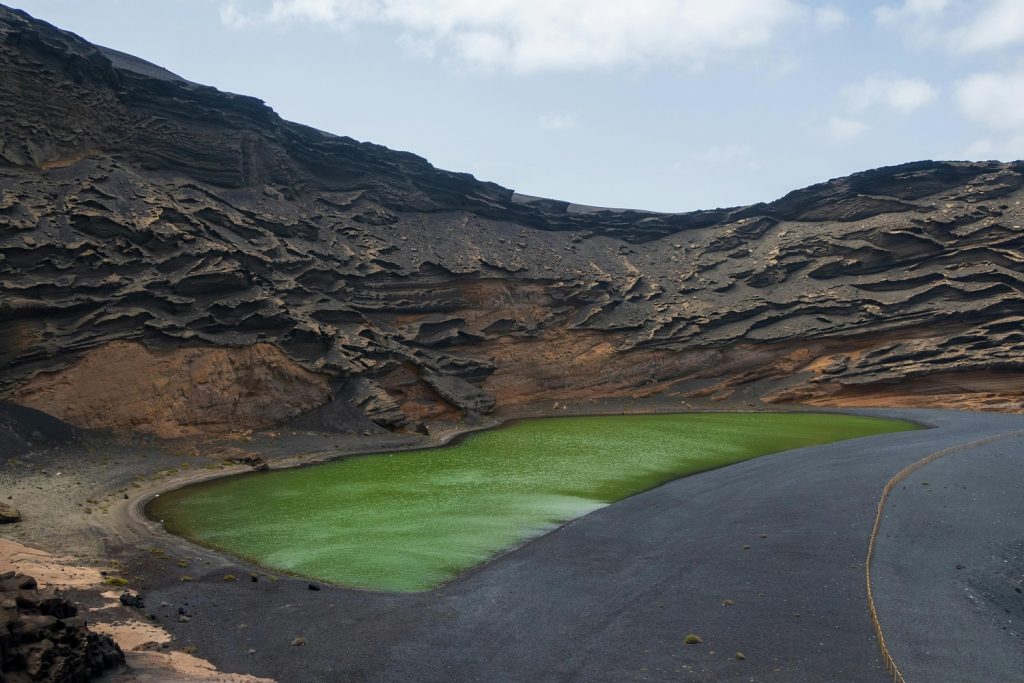 : Drive 3 west coast road Lanzarote - Charco de los Clicos green lagoon at El Golfo.