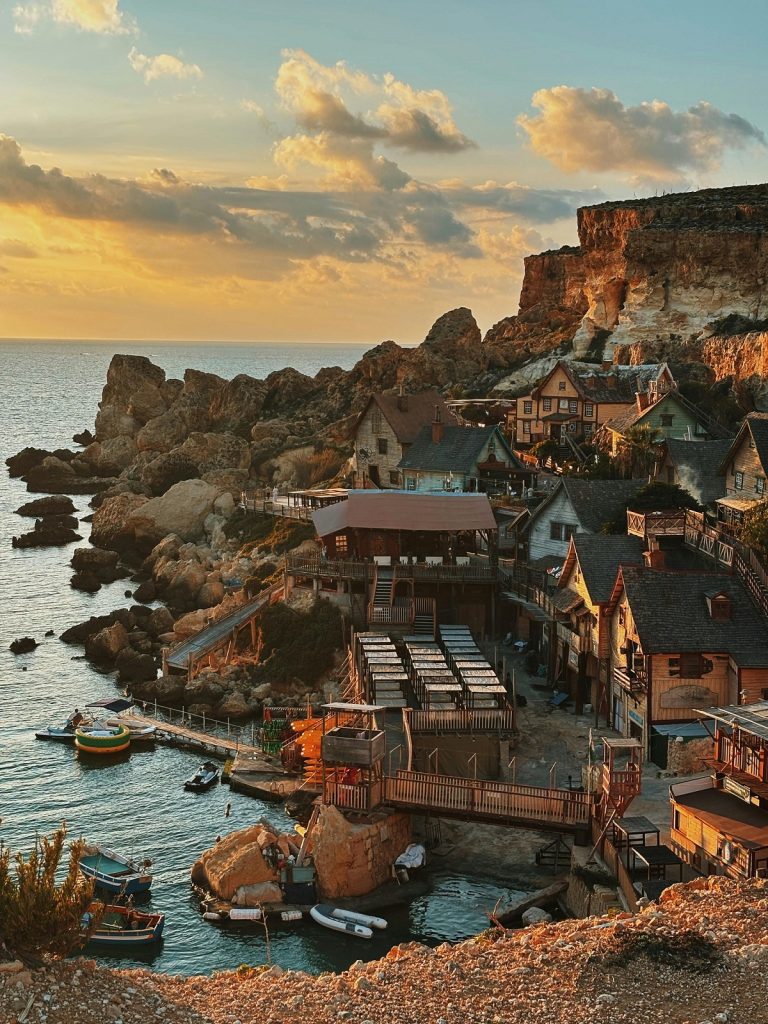 Places to visit in Malta by car - the view from Dingli Cliffs across the Mediterranean at sunset.