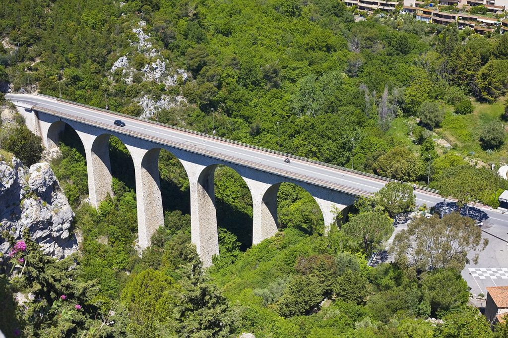 Car hire Nice Airport on the Moyenne Corniche D6007 above Monaco with the Mediterranean coast stretching to Cap Ferrat and the Monaco principality below.