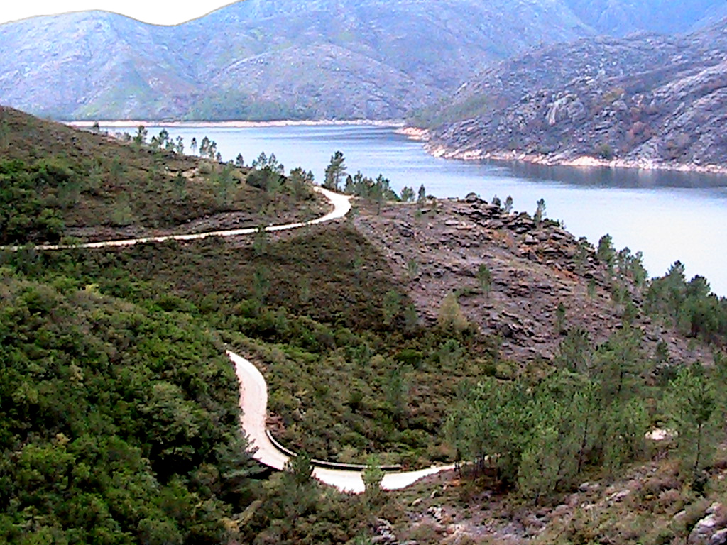 Drive 3 Peneda-Geres National Park northern Portugal mountain road with semi-wild Cachena cattle on the road and granite valleys beyond.
