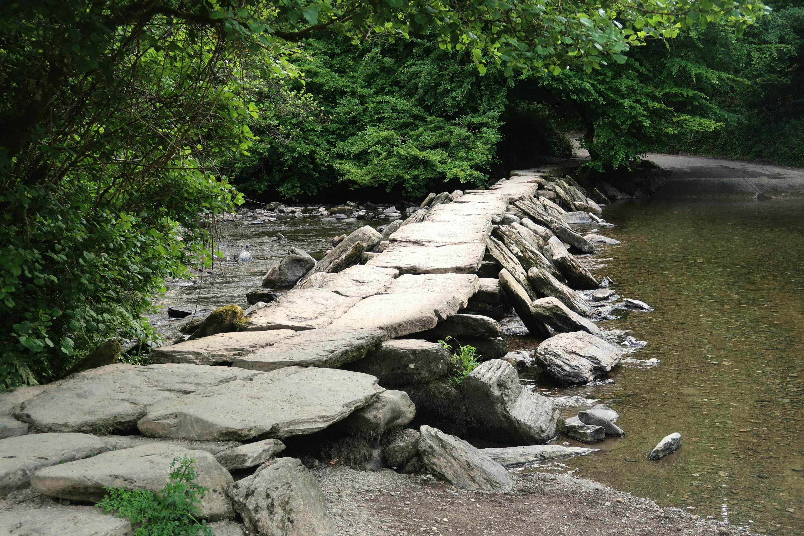 Tarr Steps clapper bridge over the River Barle, a highlight of the Exmoor scenic drives in the Barle Valley