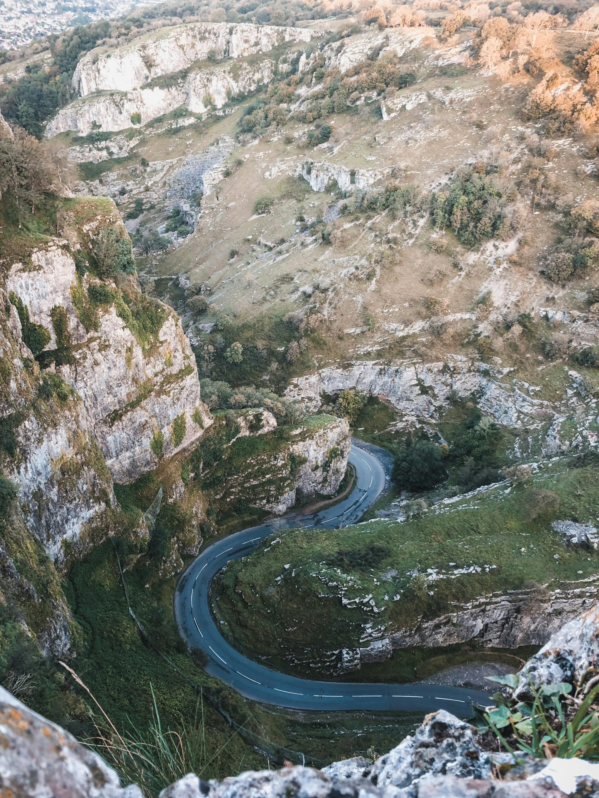 The Cheddar Gorge scenic drive on the B3135 Cliff Road, named the best driving road in the UK, winding between limestone cliffs