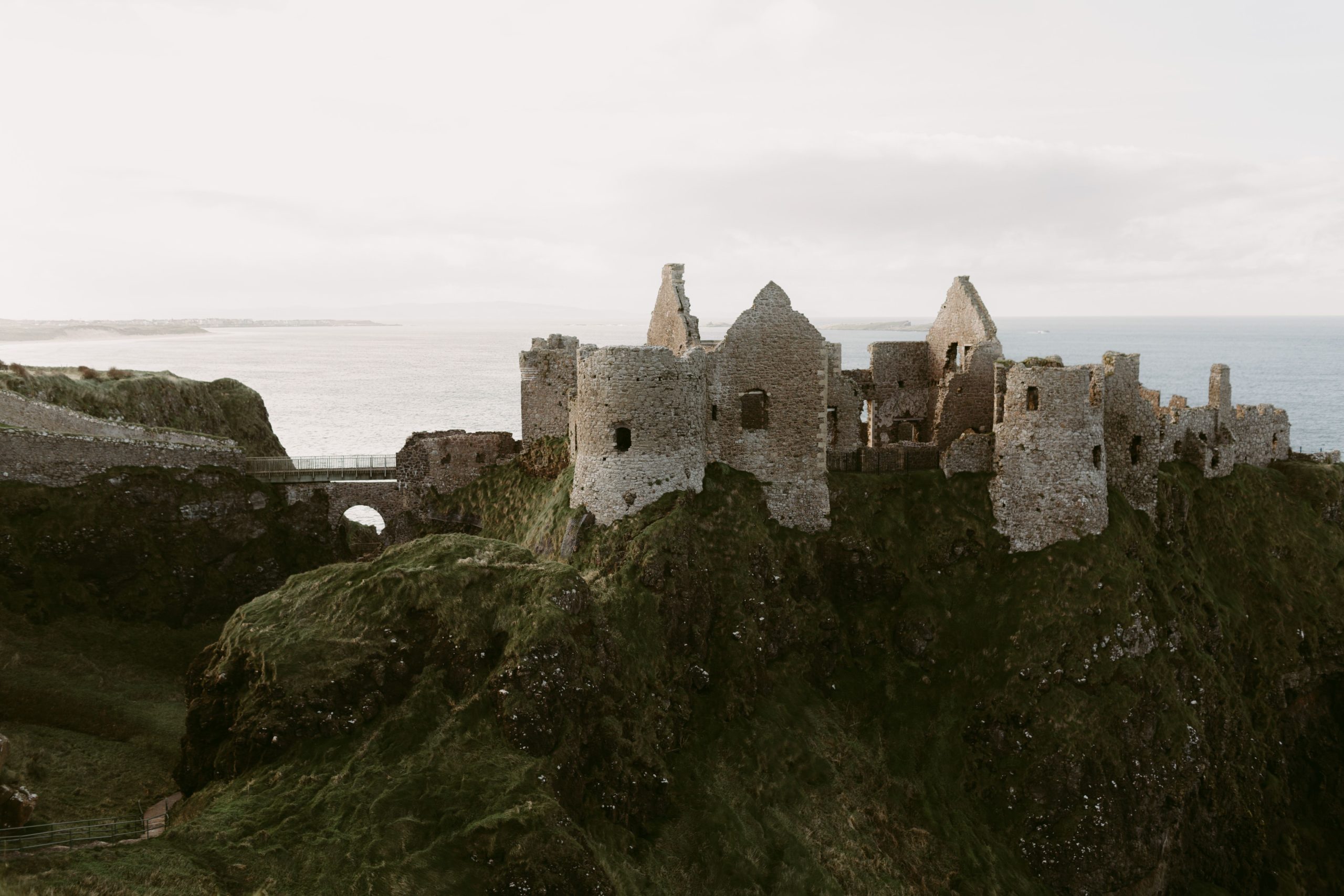 Dunluce Castle on the Causeway Coastal Route, a ruined castle on a cliff edge in County Antrim
