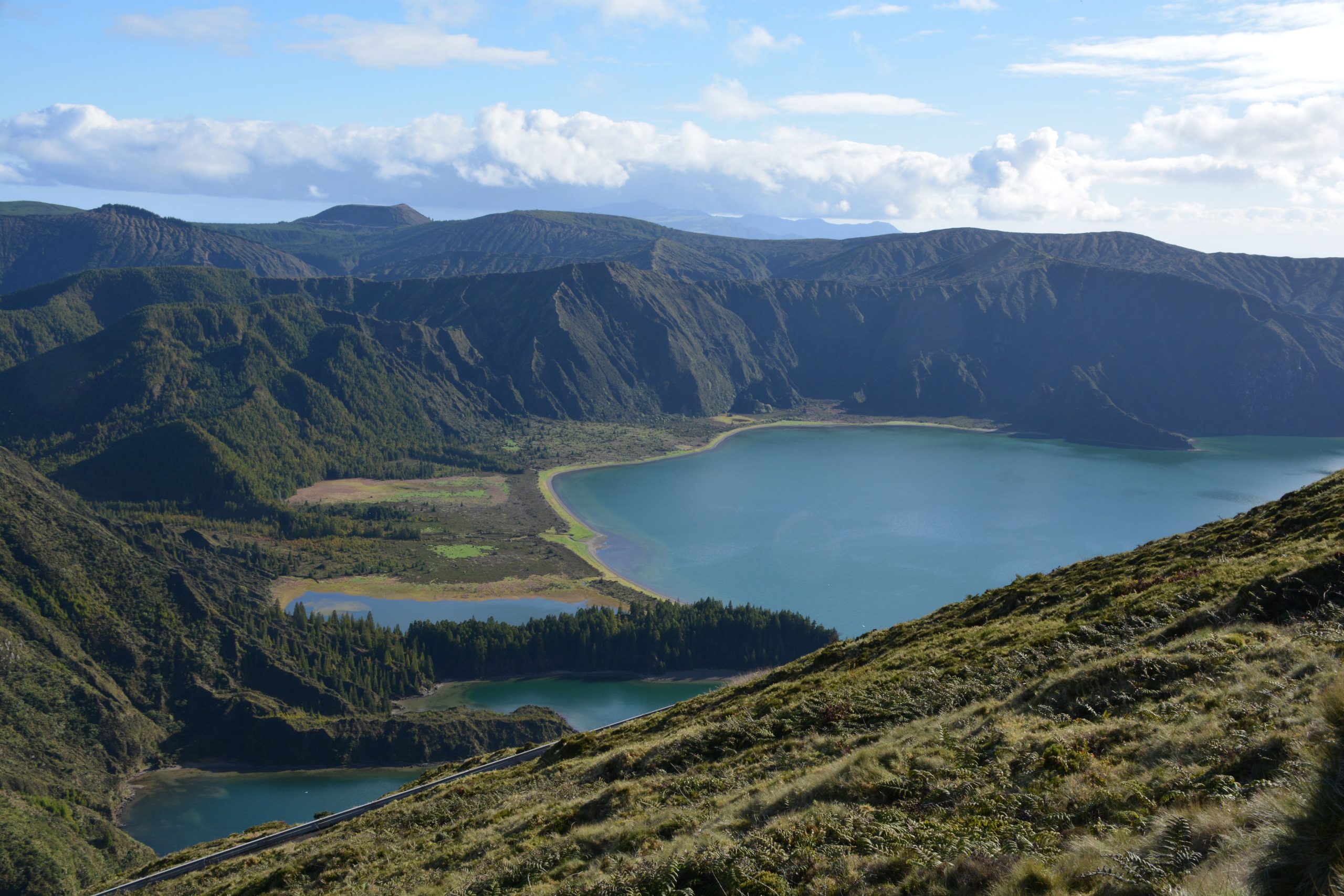 White-sand shore of Lagoa do Fogo at the foot of the crater, Sao Miguel