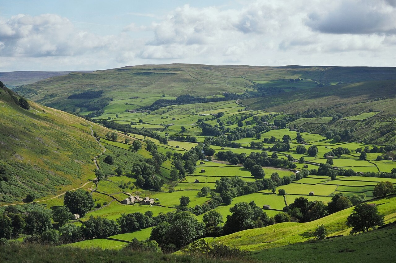 Swaledale, a classic Yorkshire Dales scenic drive with drystone walls and stone field barns