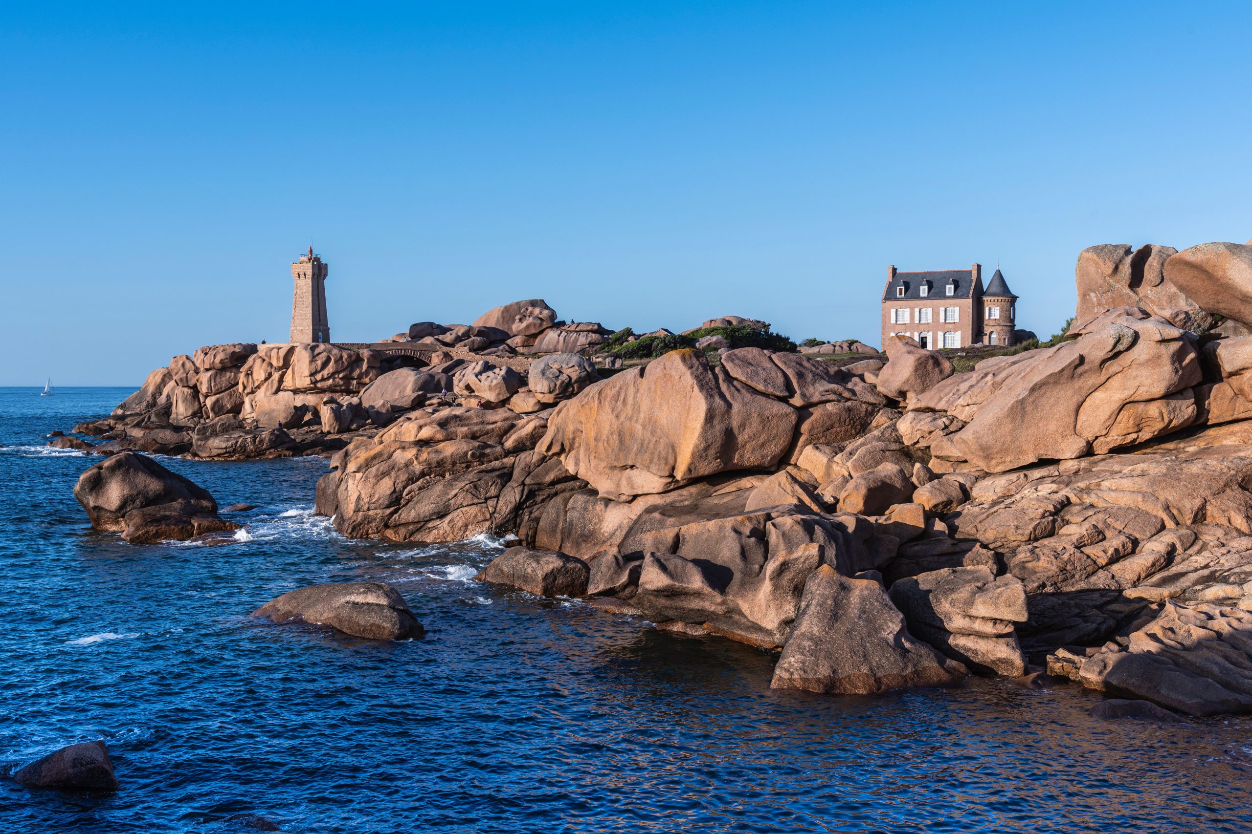 The pink Mean Ruz lighthouse at Ploumanac'h, the highlight of the Pink Granite Coast scenic drive in Brittany