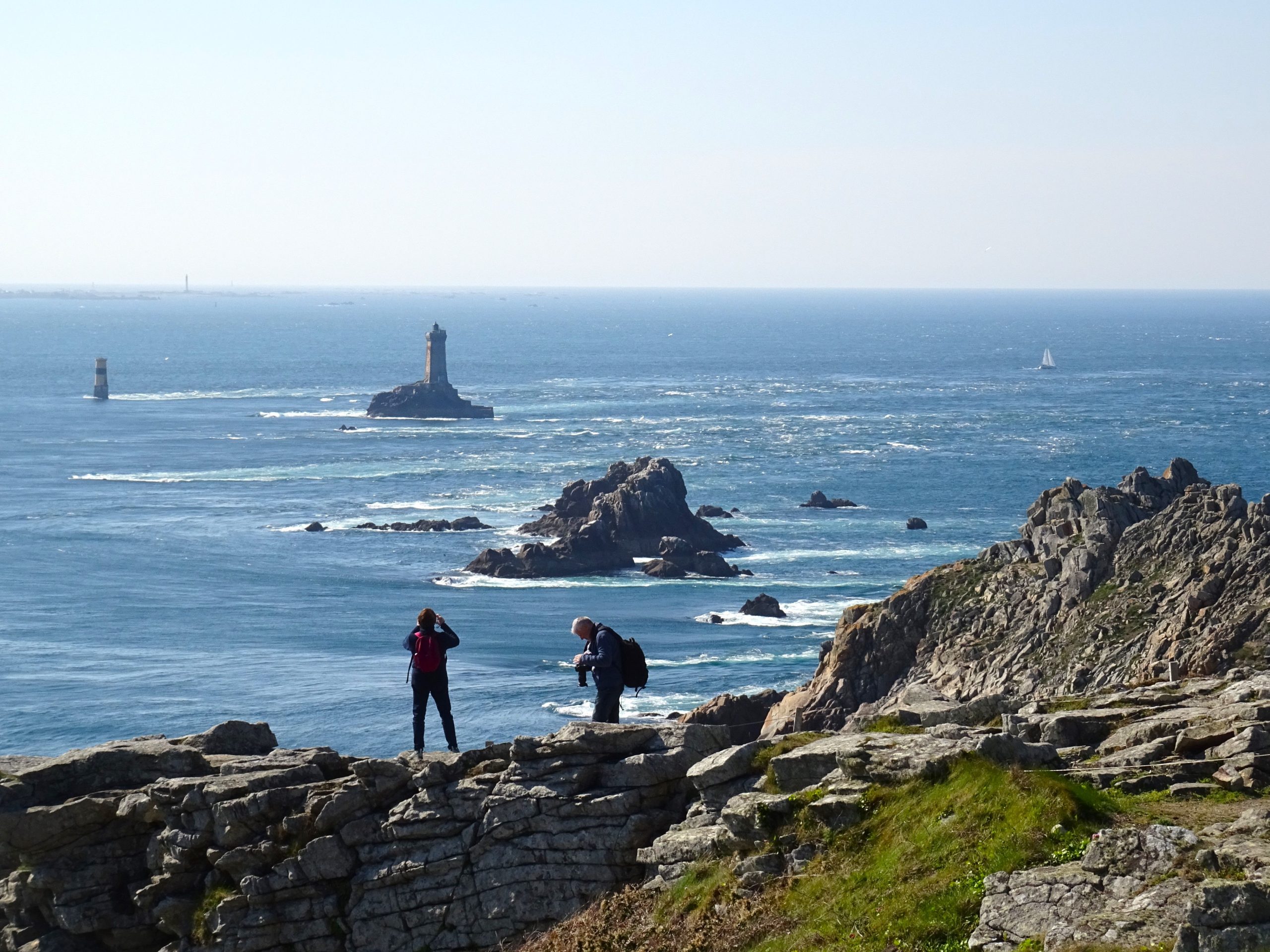 The Pointe du Raz cliffs and La Vieille lighthouse, the edge of France on the Pointe du Raz scenic drive in Brittany