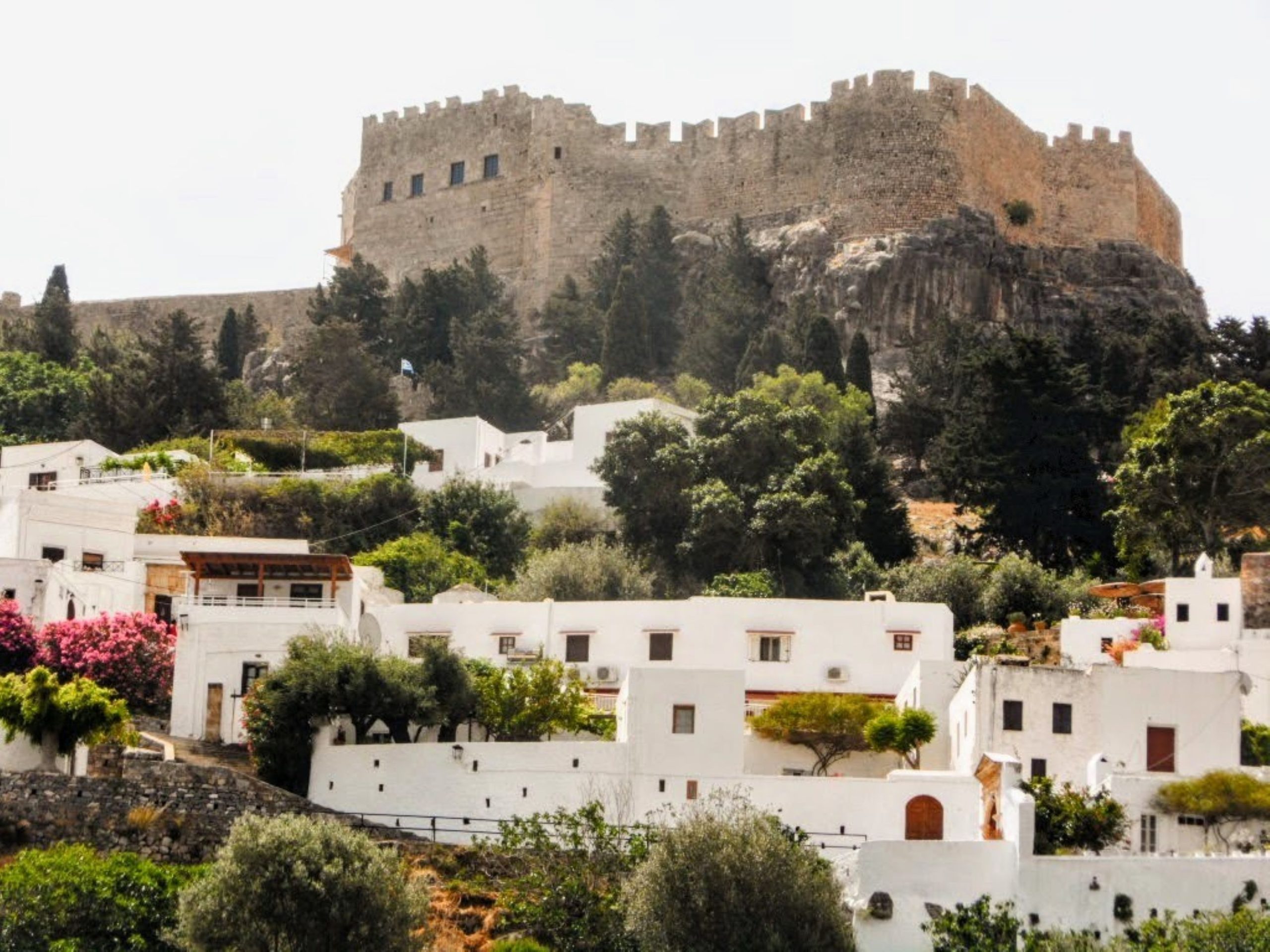 The white village of Lindos below its clifftop acropolis on the Lindos and east coast scenic drive