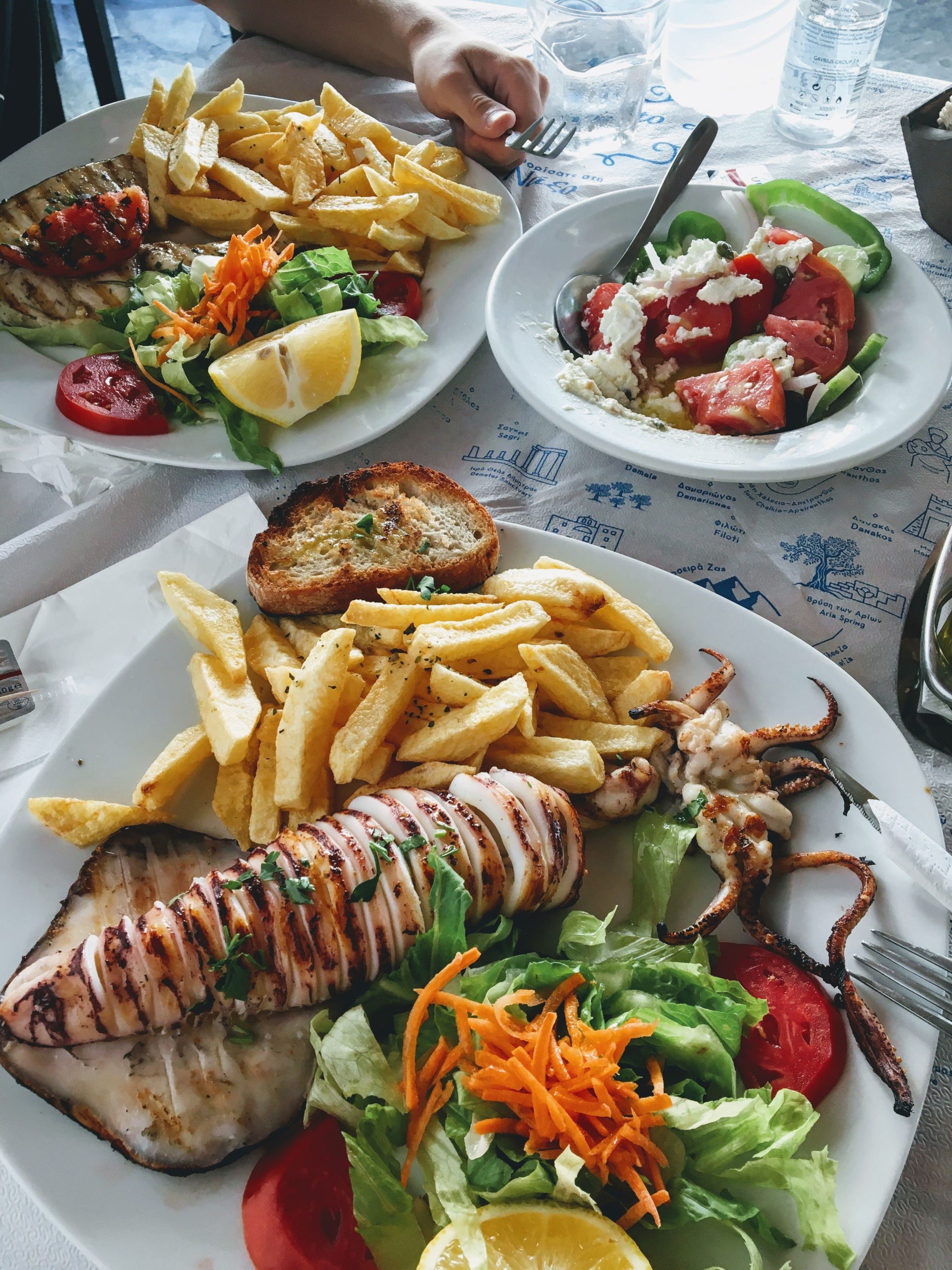 A rooftop taverna lunch in Lindos with a view of the acropolis