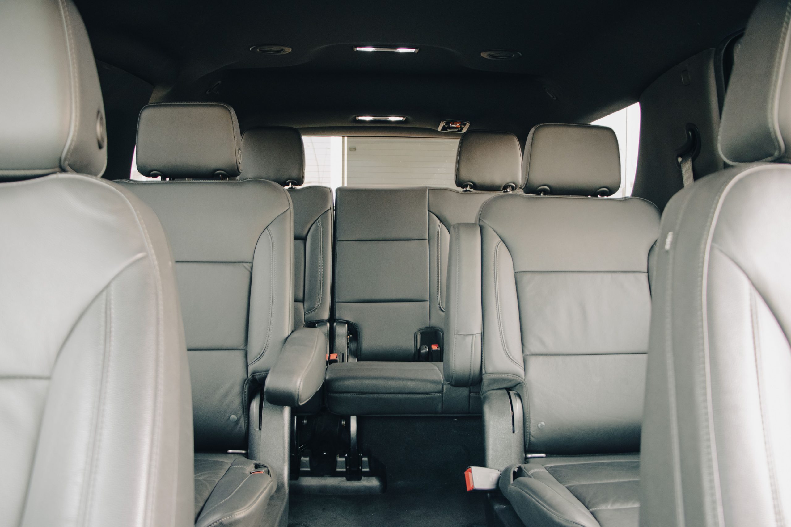 Interior of a full-size MPV showing three rows of seats and deep boot space - the correct choice for 7 seater car hire London families