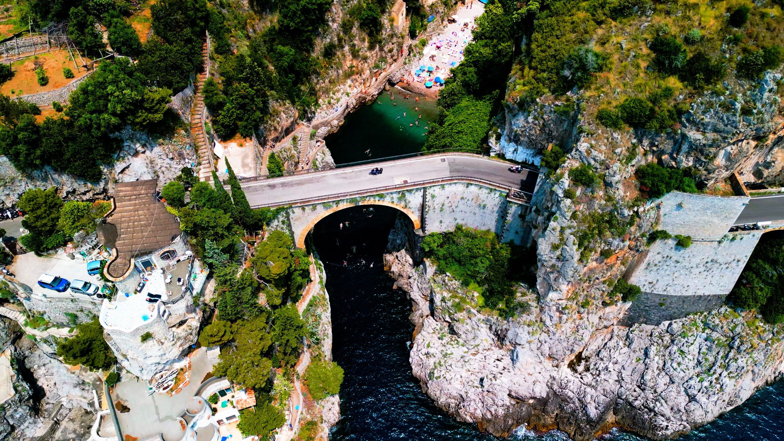 The Fjord of Furore, a dramatic gorge on the Amalfi Coast with an emerald water beach beneath the SS163 bridge