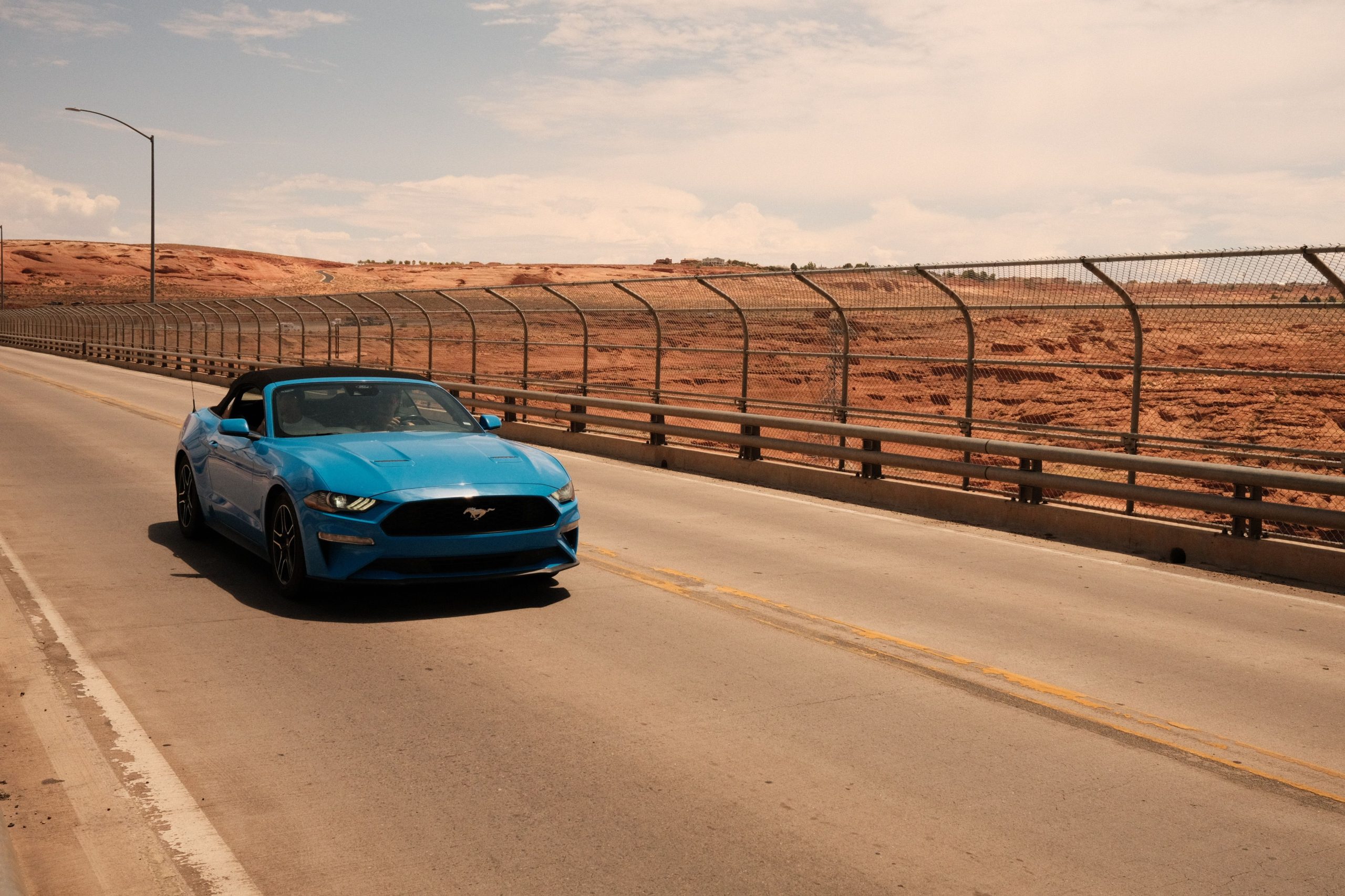 A Ford Mustang convertible on the Florida Keys Overseas Highway, the ideal vehicle for car hire in Miami Downtown