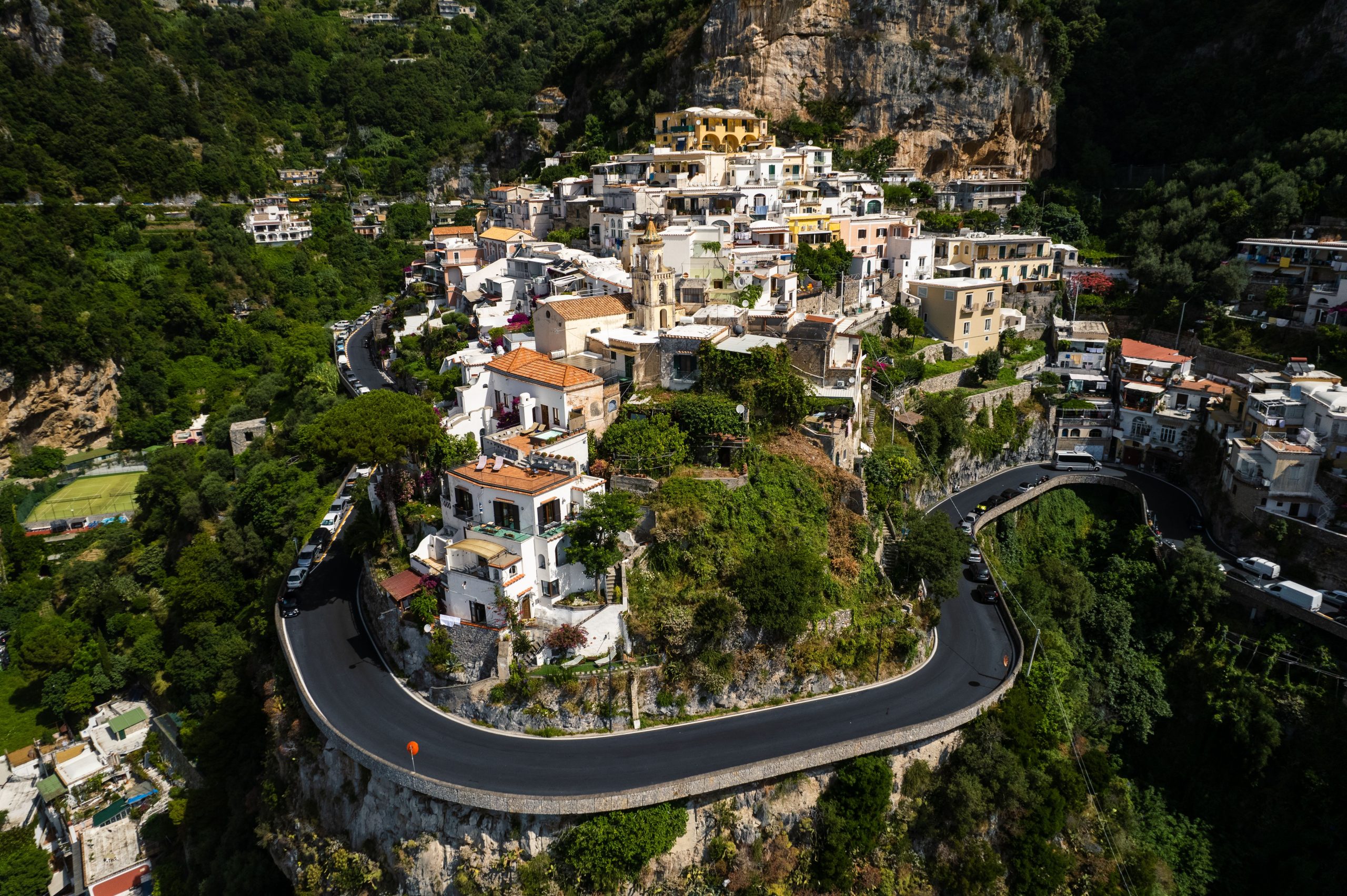The narrow SS163 coastal road on the Amalfi Coast, where a compact automatic is essential for car hire at Naples Airport visitors
